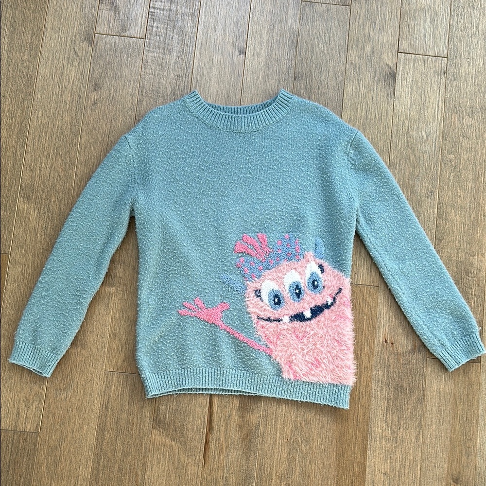 Blue Sweater with Pink Monster Design